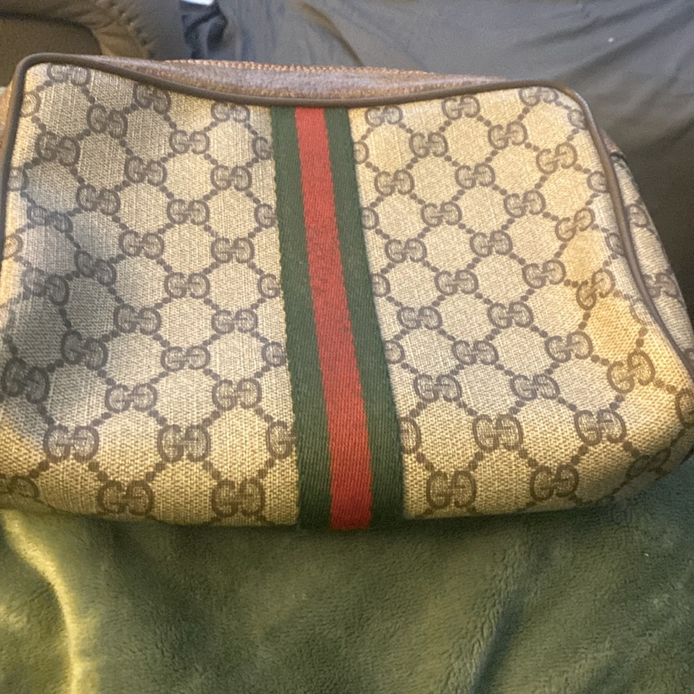 Authentic Gucci web sherry line clutch hand bag.Serial number 89.01.012